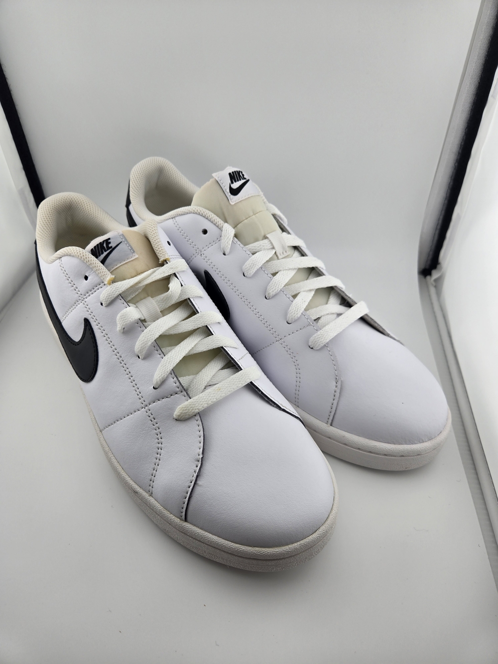 Nike White Leather Sneakers with Black Swoosh